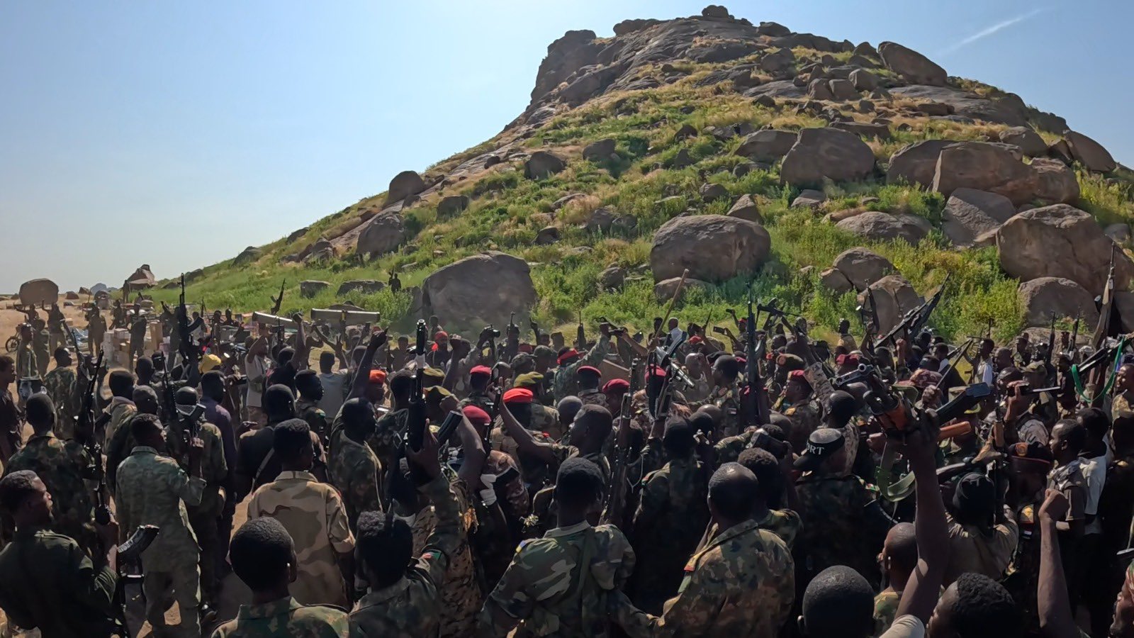 Sudanese Armed Forces soldiers raise weapons at a rally point, reflecting the military that Saudi Arabia has sought to arm through Pakistan. Photo: Wikimedia Commons / CC0