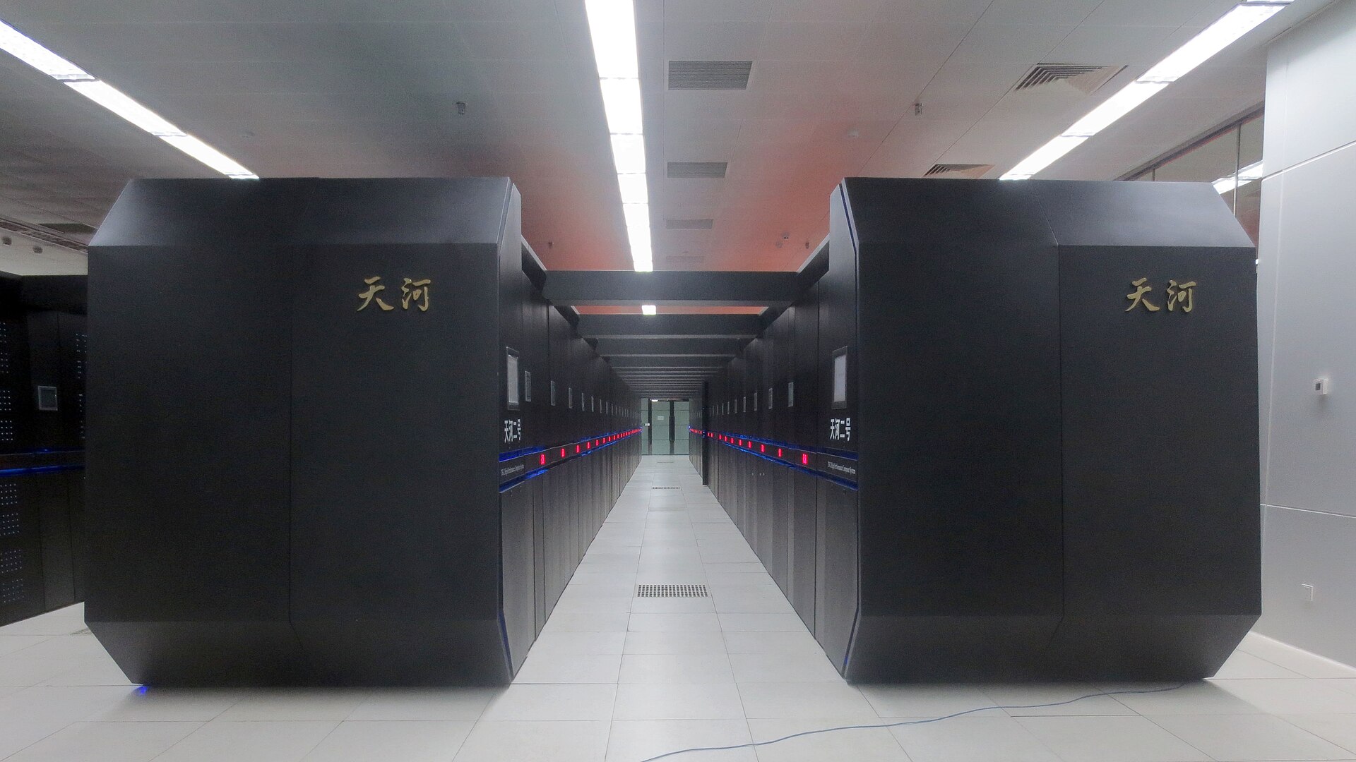 Interior of a national supercomputer center showing massive computing clusters, illustrating the scale of investment nations are making in AI computing power