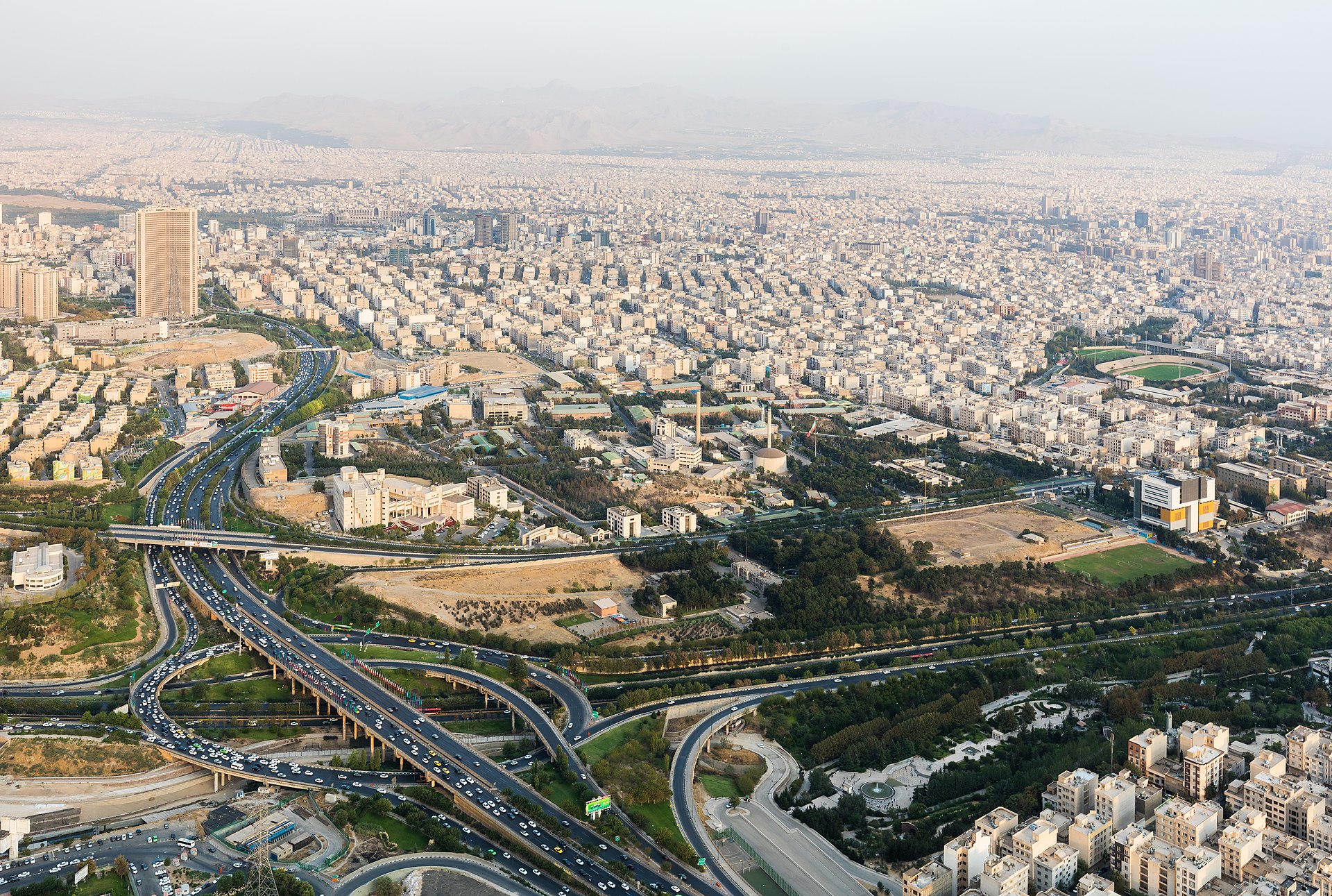 Aerial view of Tehran skyline from Milad Tower showing the sprawling Iranian capital under haze, as the country faces its worst economic crisis in modern history. Photo: Wikimedia Commons / CC BY-SA 4.0