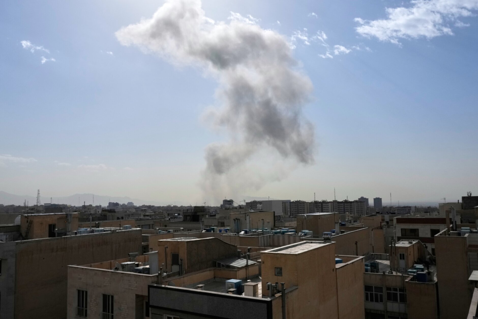 A massive smoke plume rises over Tehran after US-Israeli military strikes, February 28, 2026