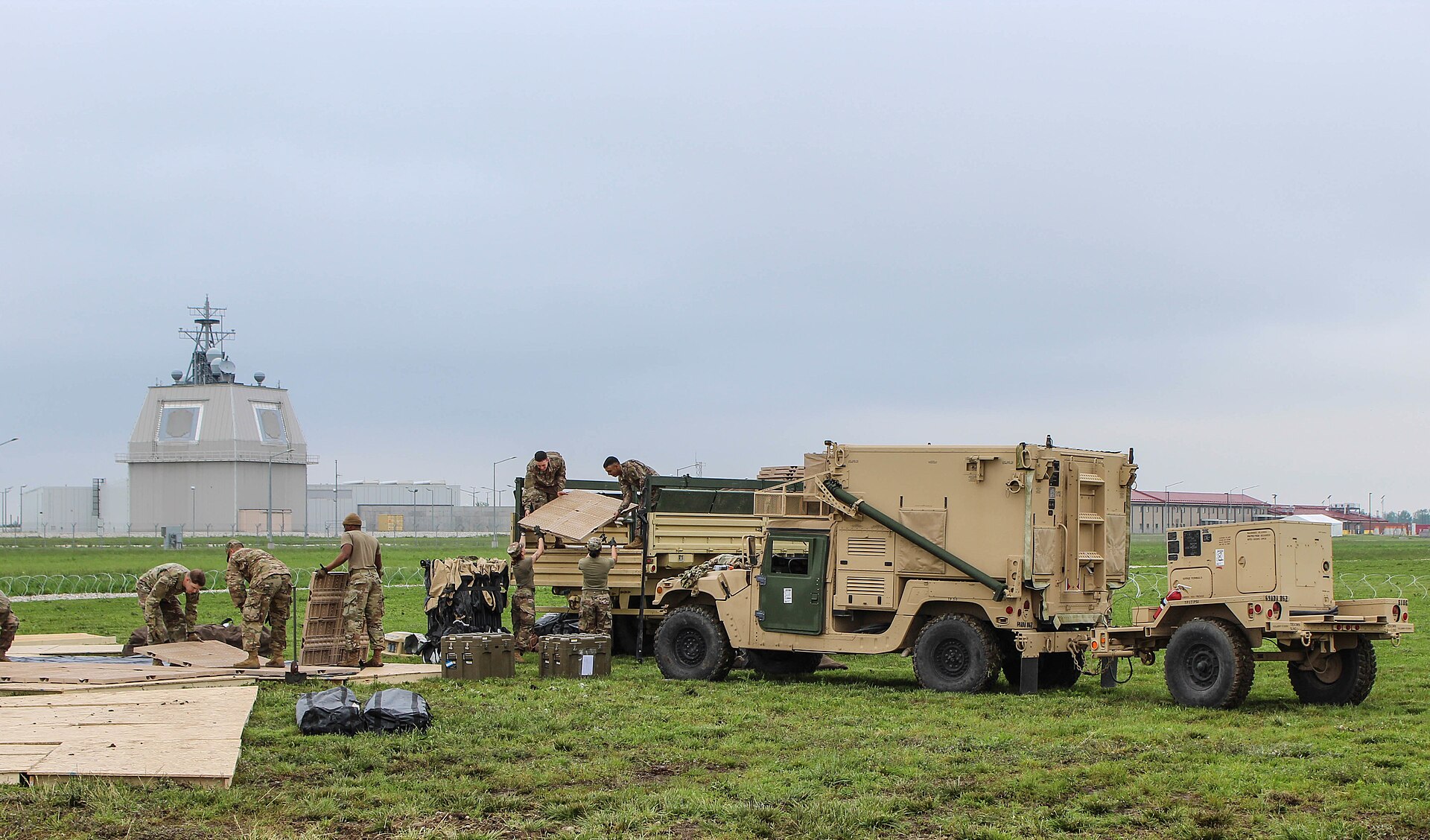 US military personnel deploy a THAAD missile defense system with the AN/TPY-2 radar dome visible in the background. Iran targeted these radar installations across Jordan, Saudi Arabia, and the UAE. Photo: US Army / Public Domain