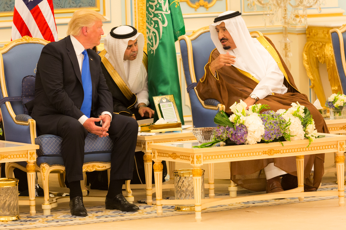 President Donald Trump and King Salman bin Abdulaziz Al Saud in diplomatic talks at the Royal Court Palace in Riyadh, with American and Saudi flags visible