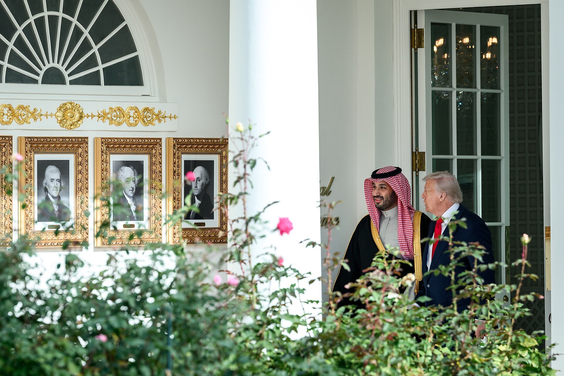 President Donald Trump and Crown Prince Mohammed bin Salman walk along the West Colonnade of the White House during a bilateral meeting in November 2025
