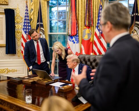 President Donald Trump drafts a Truth Social post in the Oval Office alongside Vice President JD Vance. Photo: White House / Public Domain