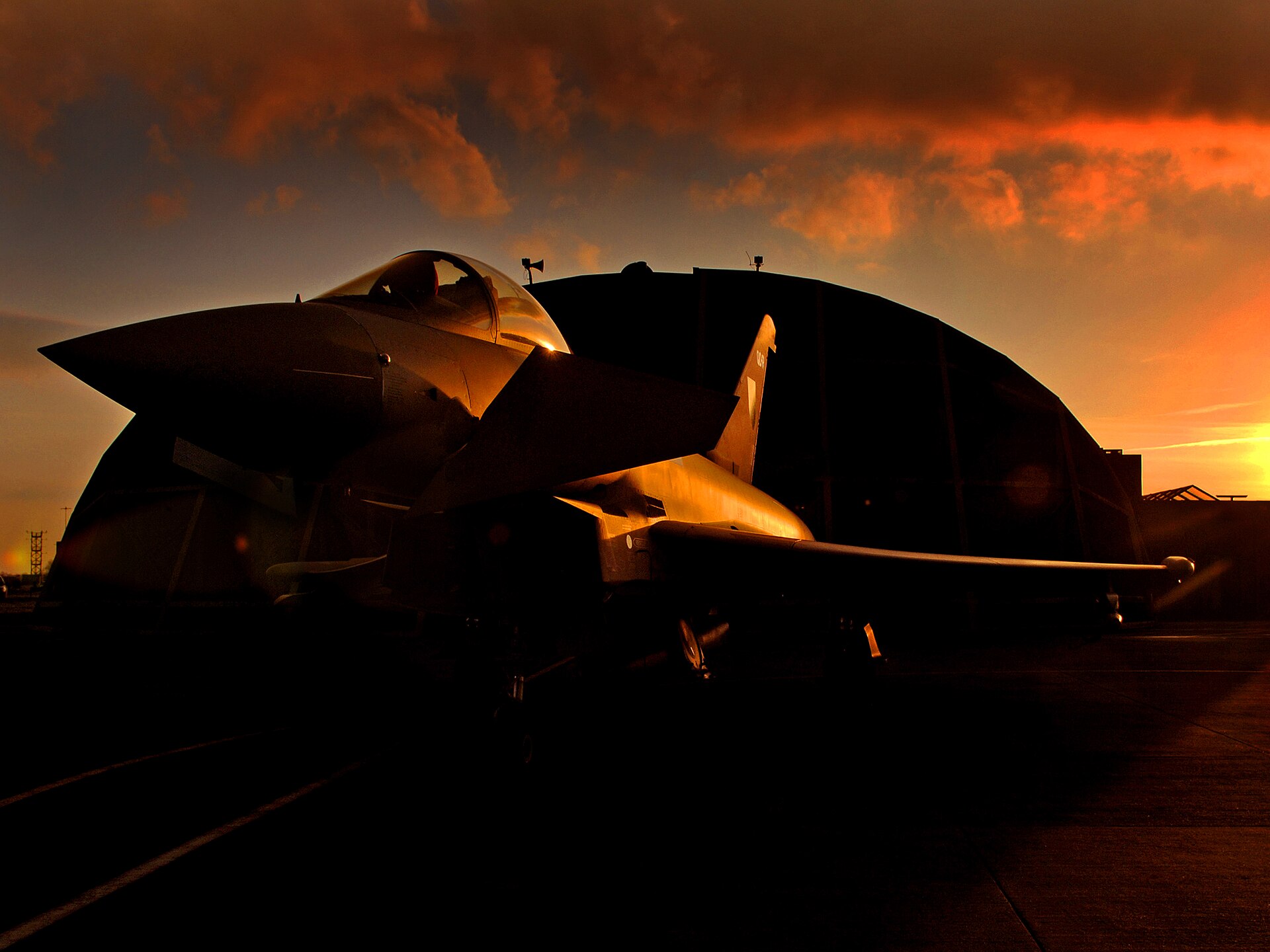 RAF Typhoon F2 fighter from 11 Squadron sits on the apron at sunset. Photo: UK Ministry of Defence / OGL v1.0