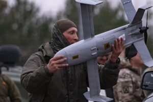 A soldier handles a Surveyor interceptor drone from the Merops counter-drone system, the type of low-cost interceptor technology Ukraine is offering to Saudi Arabia and Gulf states. Photo: U.S. Army / Public Domain