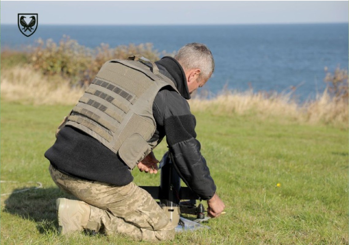 Ukrainian military operator preparing a Wild Hornets Sting interceptor drone for launch against incoming Shahed drones