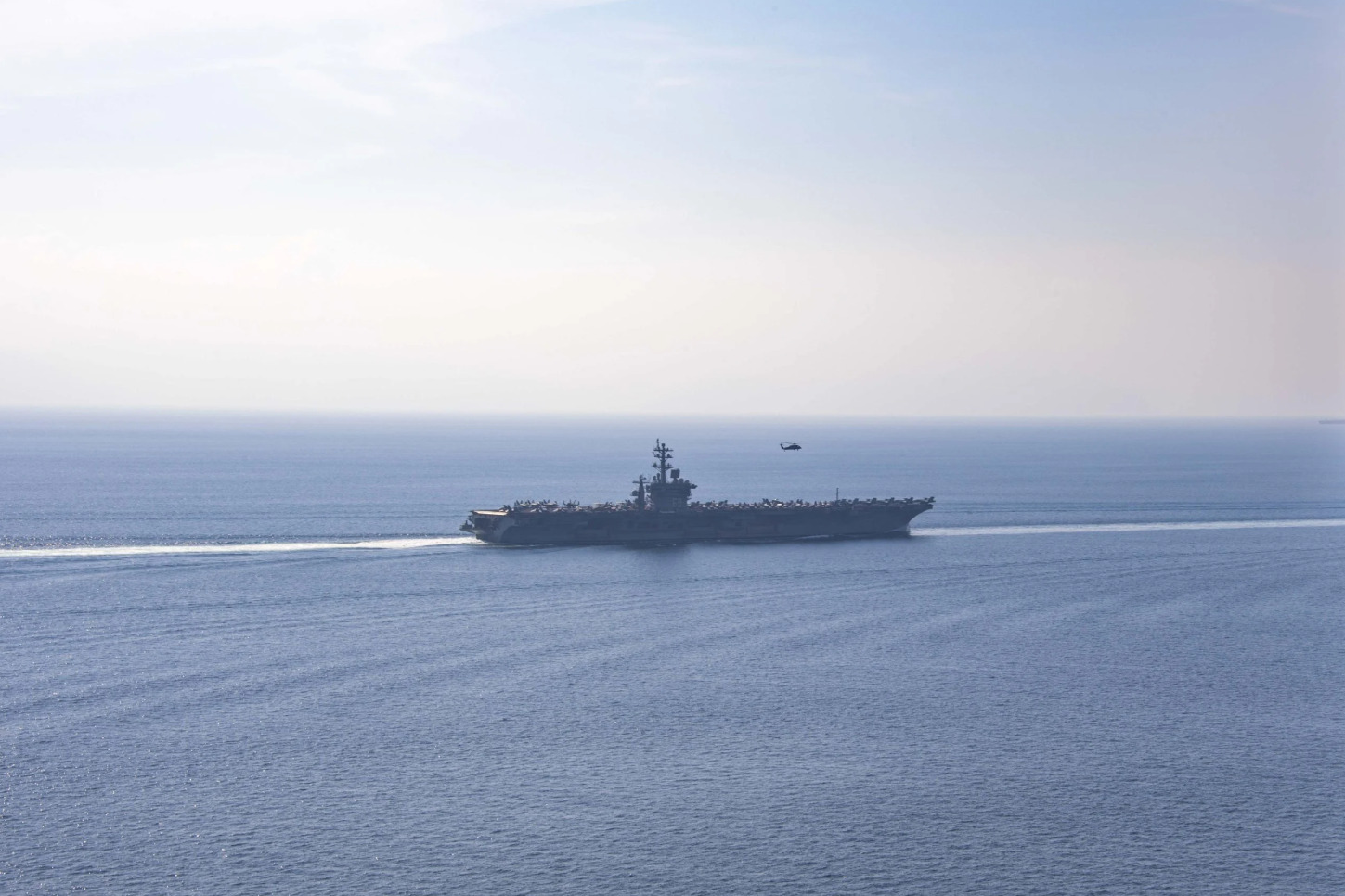 USS Dwight D. Eisenhower aircraft carrier transiting the Strait of Hormuz, the critical waterway at the center of Iran war peace negotiations. Photo: US Navy / Public Domain