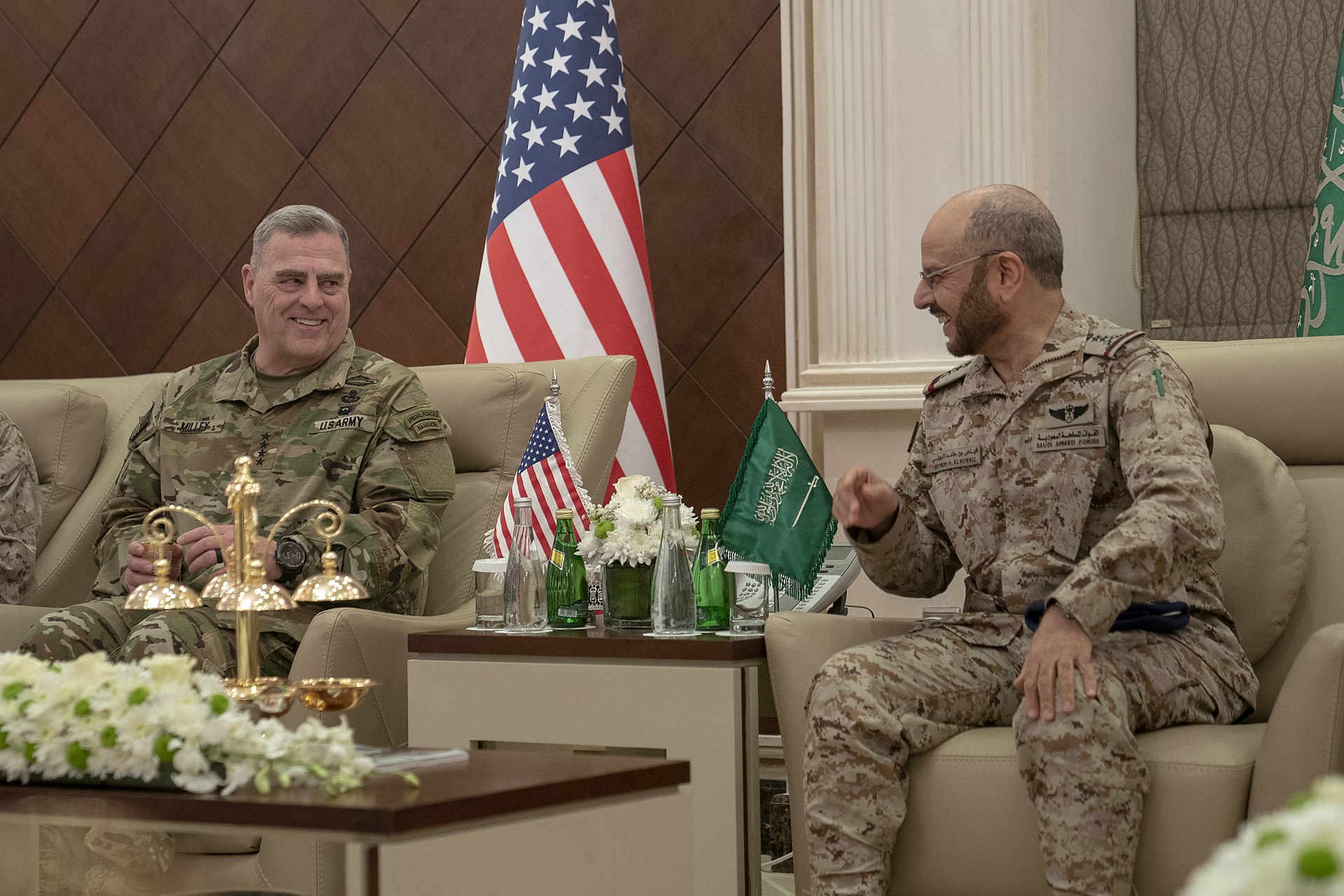 U.S. Army Gen. Mark Milley meets with Saudi military chief Gen. Fayyadh Al Ruwaili at the Saudi Ministry of Defense in Riyadh, with American and Saudi flags between them
