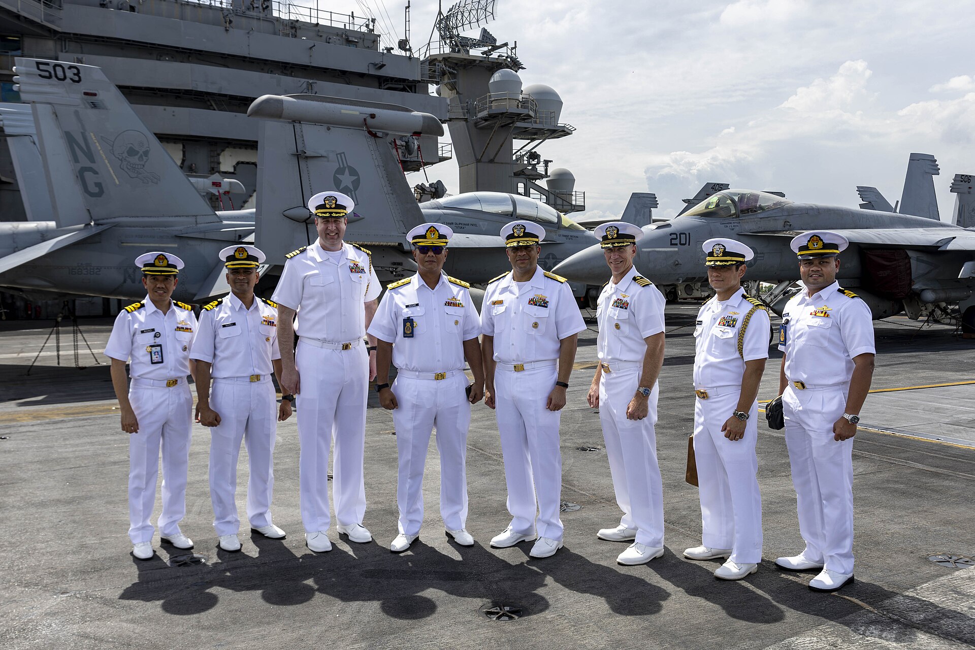 Naval officers aboard the USS Abraham Lincoln aircraft carrier, one of two US carrier strike groups deployed to the Middle East during Operation Epic Fury. Photo: US Navy / Public Domain