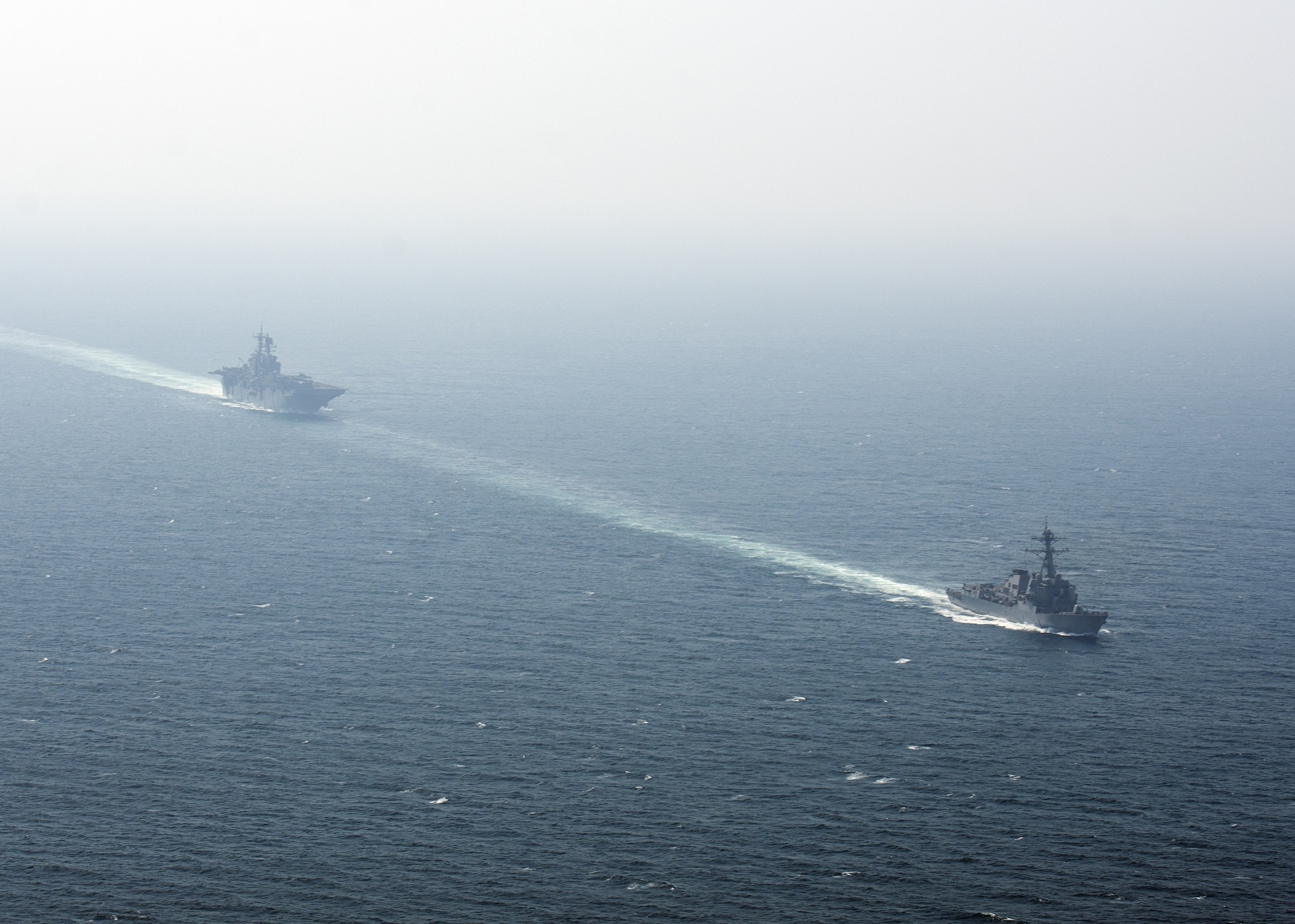 USS Bataan amphibious assault ship and USS Roosevelt guided-missile destroyer transiting the Strait of Hormuz in the Arabian Gulf