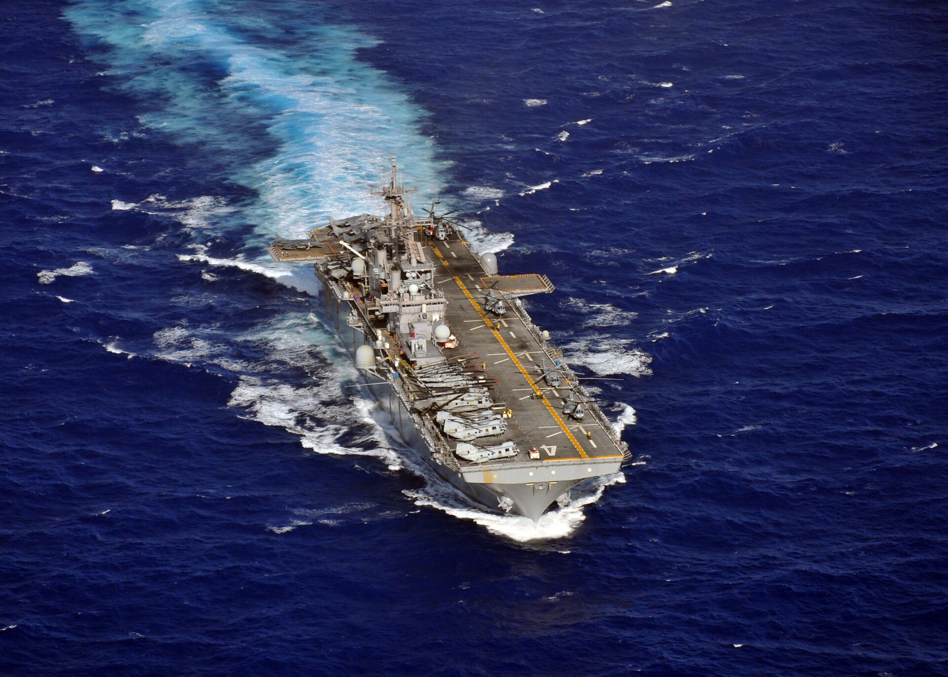 The amphibious assault ship USS Boxer (LHD 4) underway in the Pacific Ocean. The Boxer departed San Diego in March 2026 carrying the 11th Marine Expeditionary Unit toward the Persian Gulf. Photo: US Navy / Public Domain
