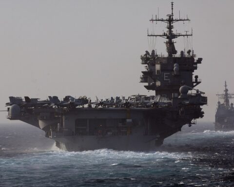 USS Enterprise aircraft carrier and USS Vicksburg cruiser transiting the Bab el-Mandeb Strait between Yemen and Djibouti