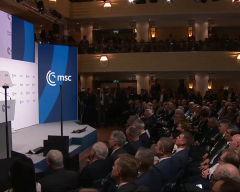 U.S. Vice President JD Vance delivers remarks at the Munich Security Conference podium before a packed audience of world leaders and diplomats