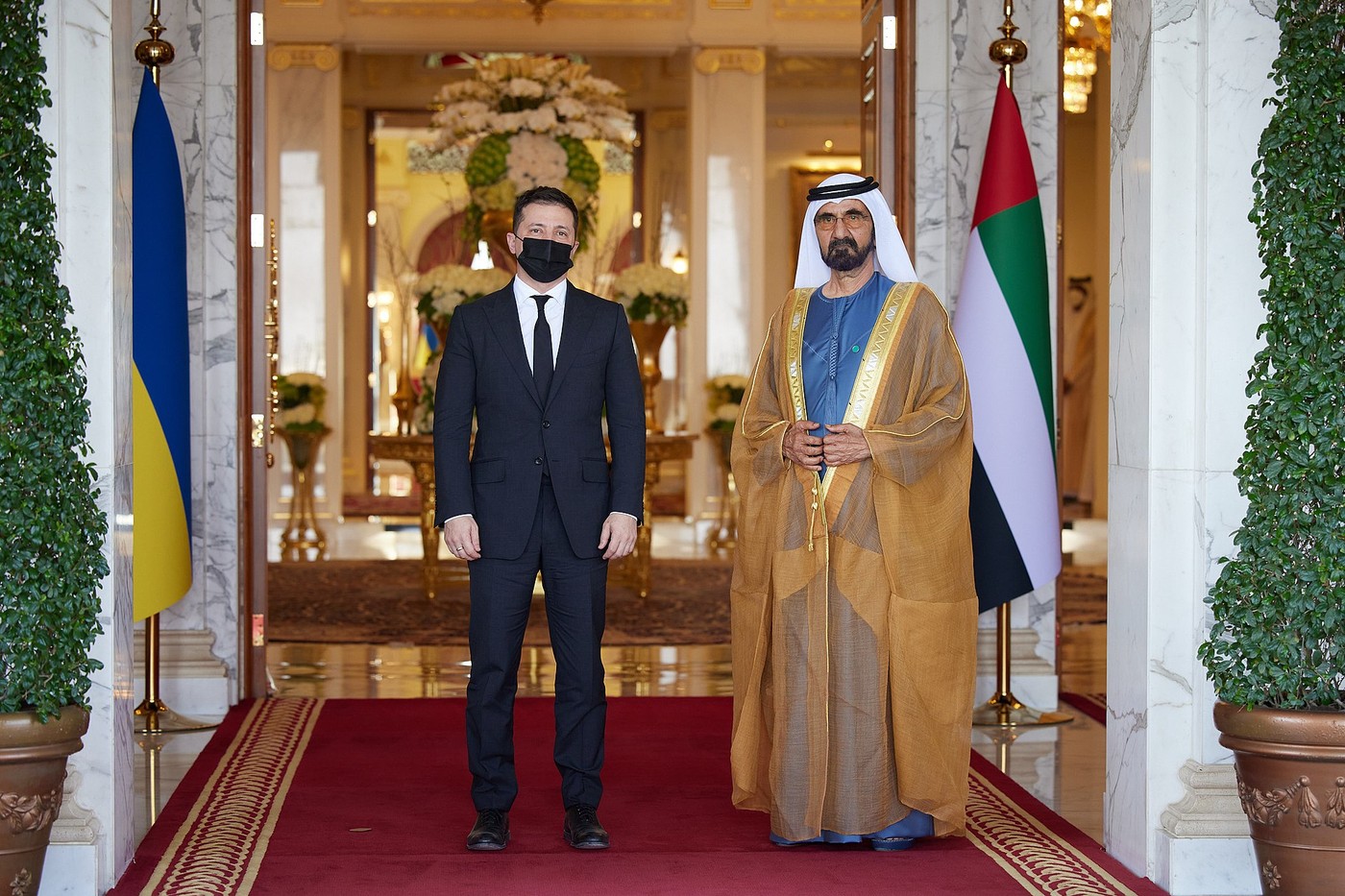 Ukrainian President Volodymyr Zelensky meeting with UAE Prime Minister Mohammed bin Rashid Al Maktoum during a Gulf diplomatic visit, with Ukrainian and UAE flags visible