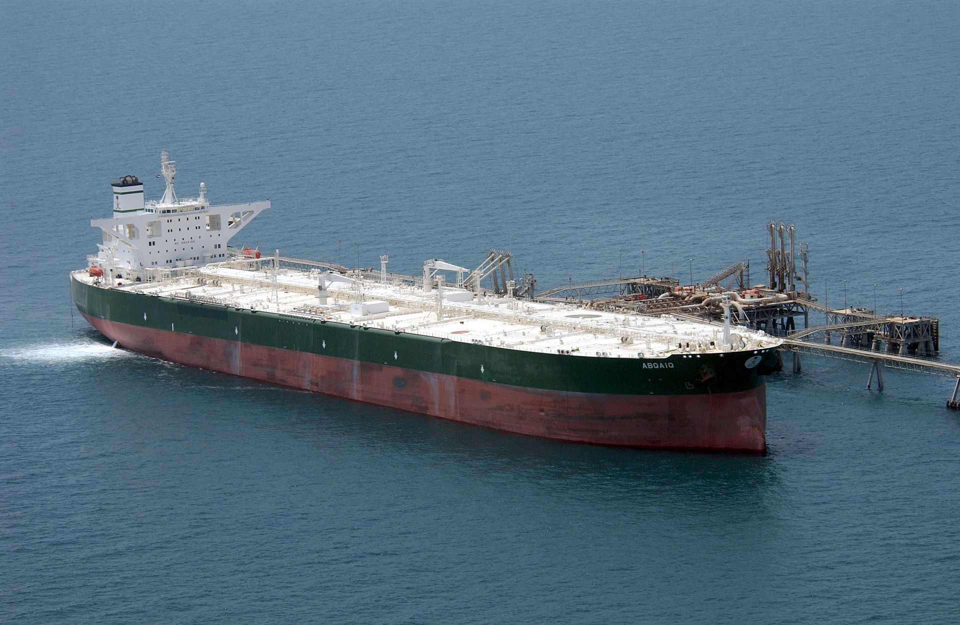 Commercial supertanker AbQaiq loading crude oil at an offshore Gulf terminal — Bahri VLCCs of this class sail under Panama, Liberia, and Marshall Islands flags, placing them in the two-tier ceasefire framework's unprotected zone