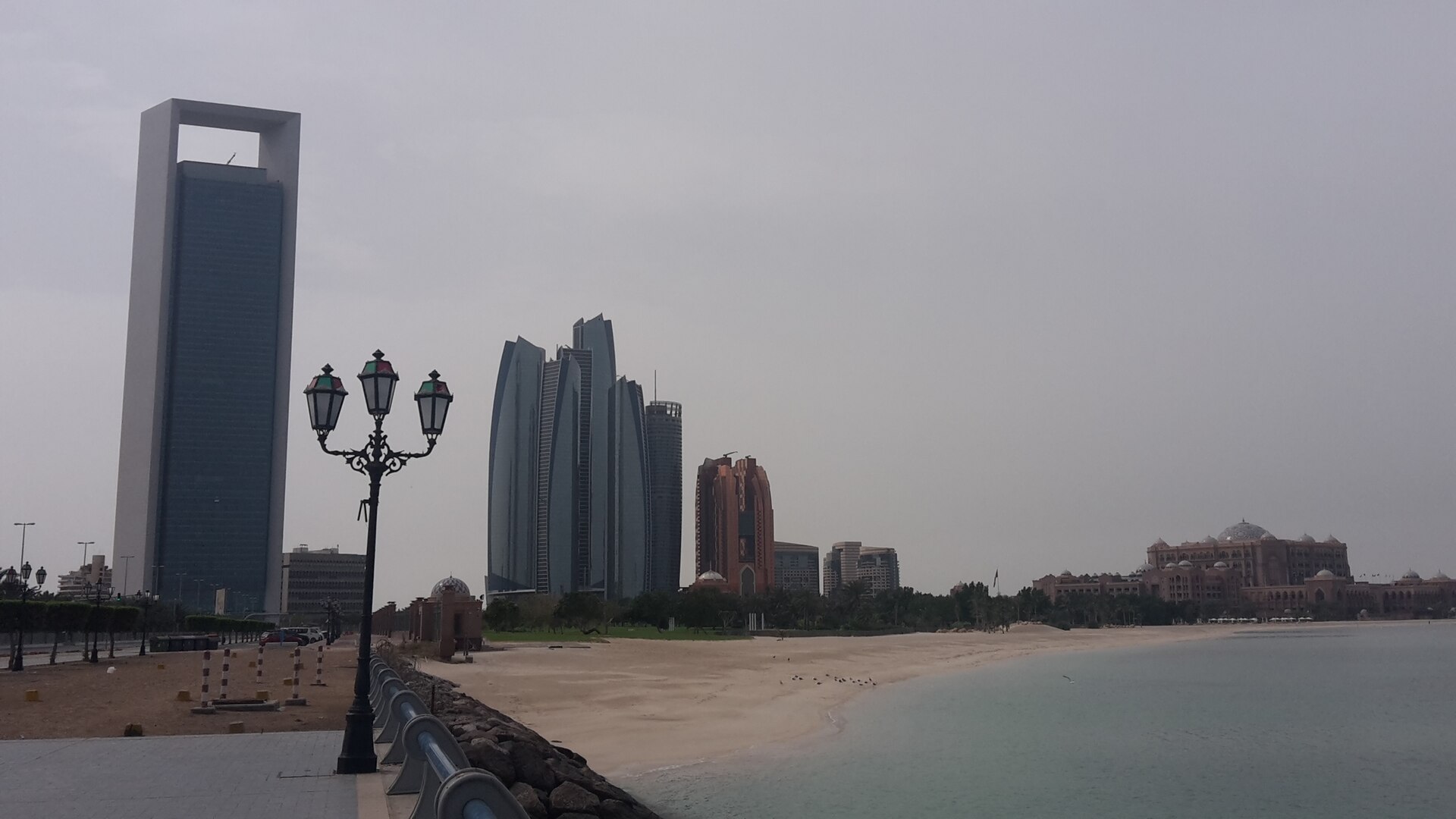 Abu Dhabi Corniche skyline with ADNOC headquarters tower on the left, UAE