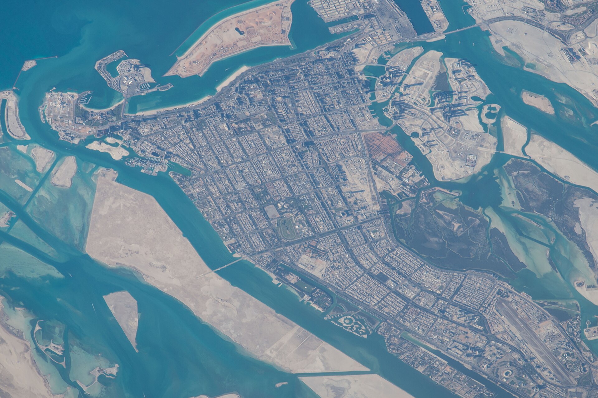 Abu Dhabi island city and surrounding Persian Gulf channels photographed from the International Space Station during Expedition 46