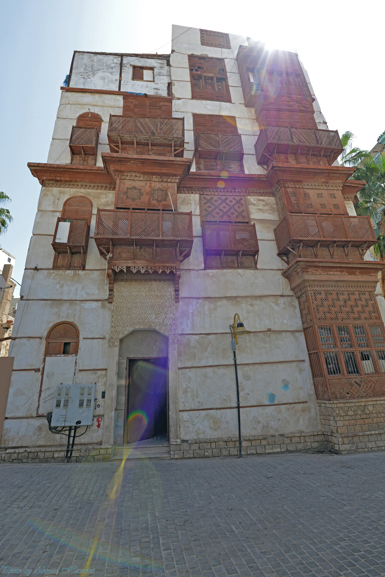 Traditional coral-stone building with wooden rawasheen balconies in Jeddah Al-Balad historic district