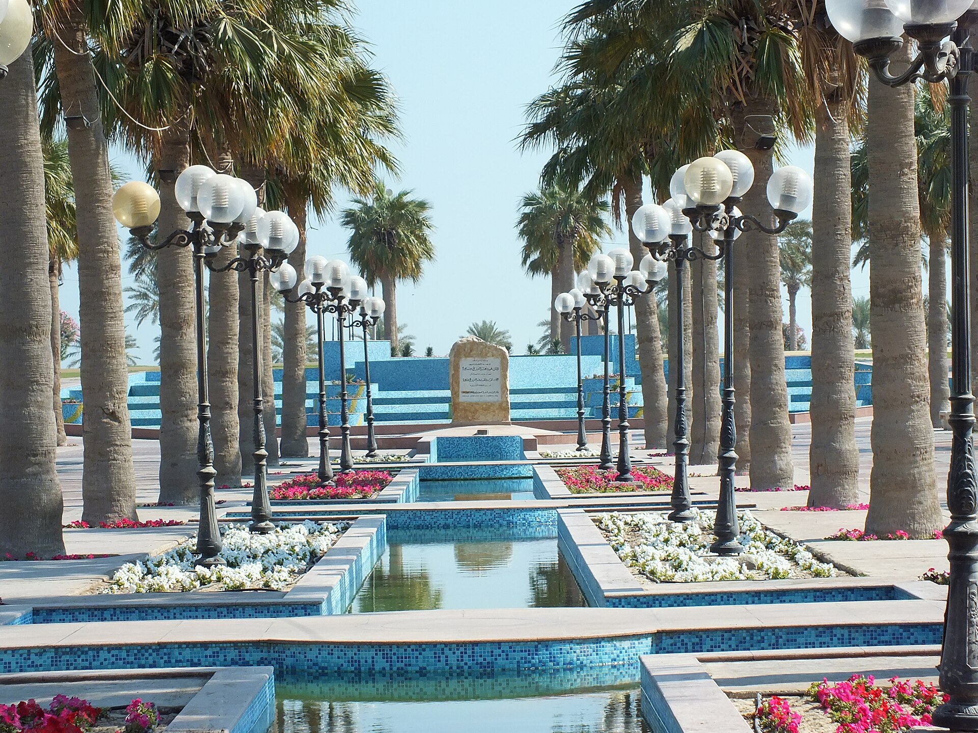 Al Khobar Corniche with palm trees, landscaped gardens, and ornamental fountains along the Gulf waterfront