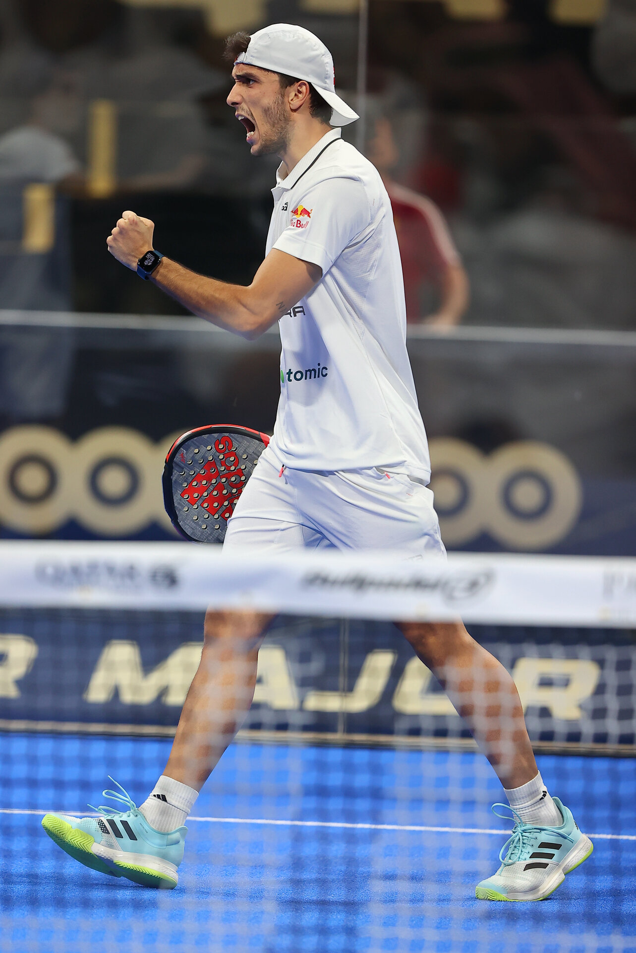 Professional padel player Alejandro Galán celebrating a point on court