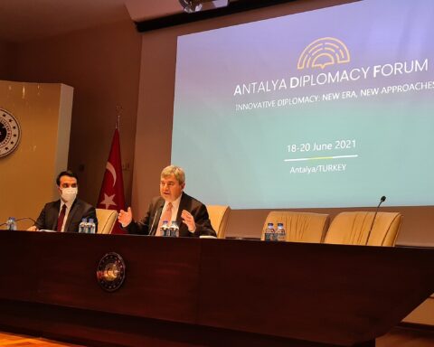 Antalya Diplomacy Forum plenary session with Turkish Ministry of Foreign Affairs emblem and forum branding on screen
