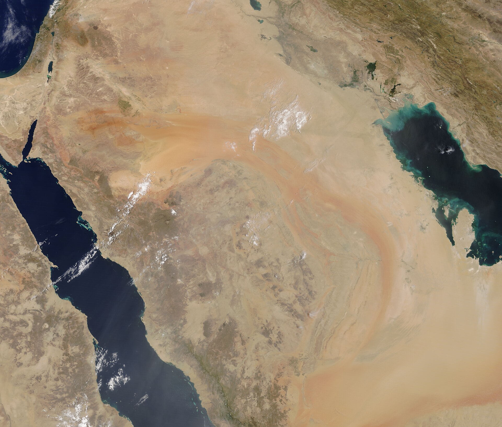 NASA MODIS satellite view of the Arabian Peninsula, showing the Red Sea (left), Persian Gulf (right), and Sea of Oman — the three bodies of water named by Iranian General Abdollahi as targets for export interdiction