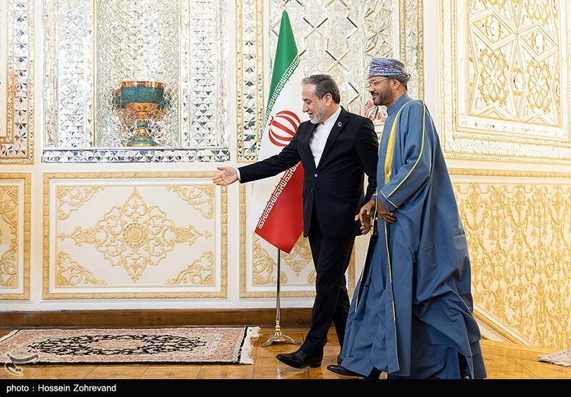 Iranian FM Araghchi walks with Omani FM Badr Al-Busaidi at the Iranian Foreign Ministry in Tehran, 2025 — Oman served as Iran's primary back-channel to the US throughout the 2025-2026 nuclear and war diplomacy