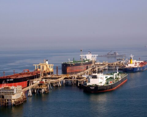 Multiple supertankers loading crude oil at the Al Basra Oil Terminal in the Northern Arabian Gulf — a US Navy aerial photograph showing the scale of Persian Gulf crude export operations