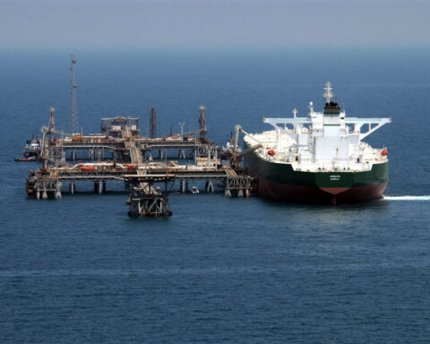 Commercial crude oil tanker approaching offshore loading terminal in the Arabian Gulf, 2003. The tanker AbQaiq readies to load approximately 2 million barrels at the Mina al-Bakr offshore terminal.