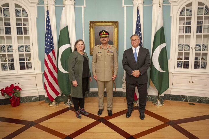 Pakistan Army Chief Asim Munir in military uniform with US Acting Deputy Secretary Victoria Nuland at the State Department, December 2023, with US and Pakistan flags