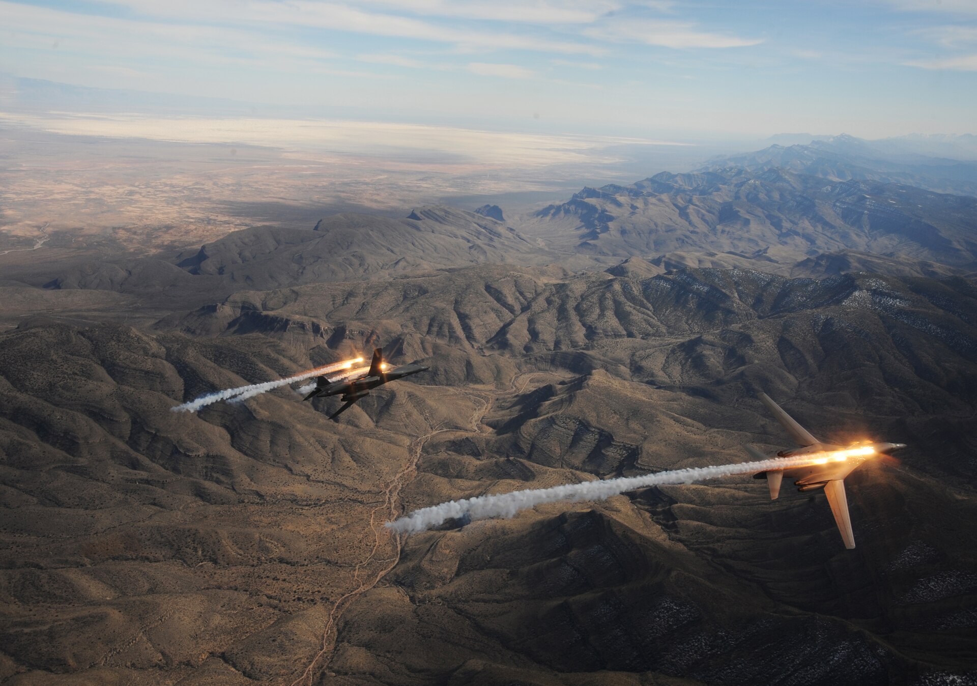 Two B-1B Lancer bombers from the 28th Bomb Squadron release chaff and flares during a training mission — the B-1B is among the strike assets deployed to CENTCOM ahead of Trump's April 7, 2026 deadline to Iran