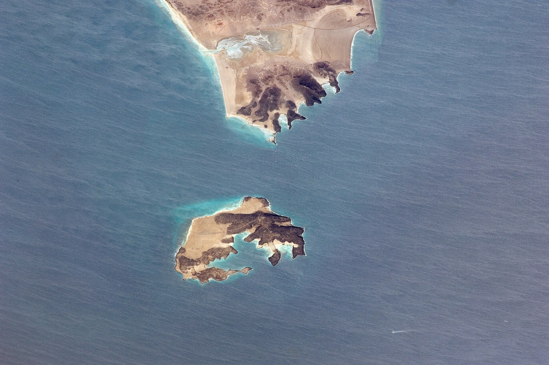 Perim Island in the Bab el-Mandeb Strait photographed from the International Space Station, showing the narrow shipping channels on either side of the island