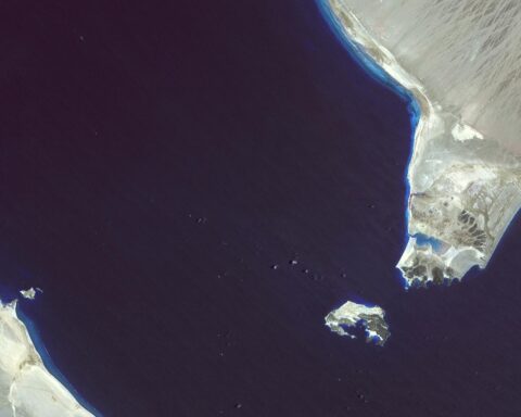 Bab el-Mandeb strait satellite view showing Perim Island dividing shipping channels between Yemen and Djibouti