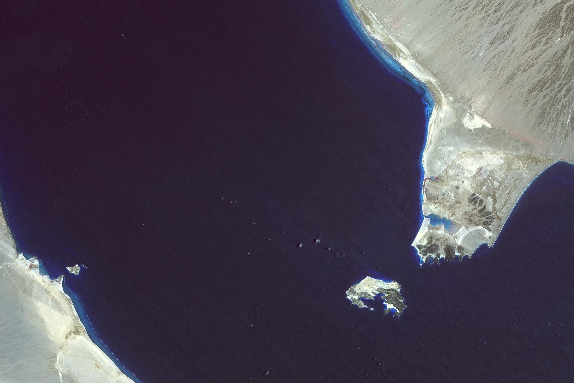 Bab el-Mandeb strait satellite view showing Perim Island dividing shipping channels between Yemen and Djibouti