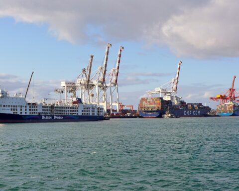 Container ships berthed at commercial port quay with cranes, similar to Khalifa Bin Salman Port in Bahrain where MSC Ishyka was moored on April 4, 2026
