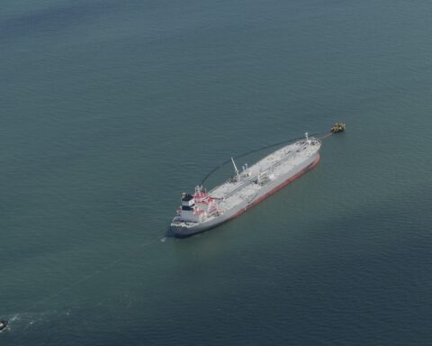 Aerial view of a crude oil tanker loading at a single-point mooring buoy terminal — the same offshore infrastructure type used at Yanbu to handle VLCCs when the East-West Pipeline delivers oil to the Red Sea coast