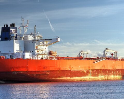 Crude oil supertanker On Precious at port — VLCC crude oil carrier representing the physical oil market where prices reached $148/bbl in April 2026