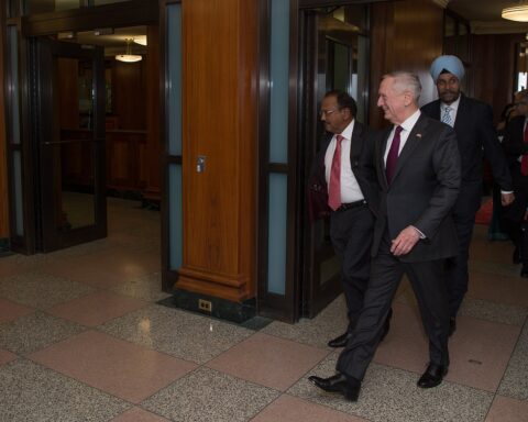 Indian NSA Ajit Doval walks with US Defense Secretary James Mattis at the Pentagon, March 2017 — the India-US security partnership that frames New Delhi's compliance bind on Iran sanctions