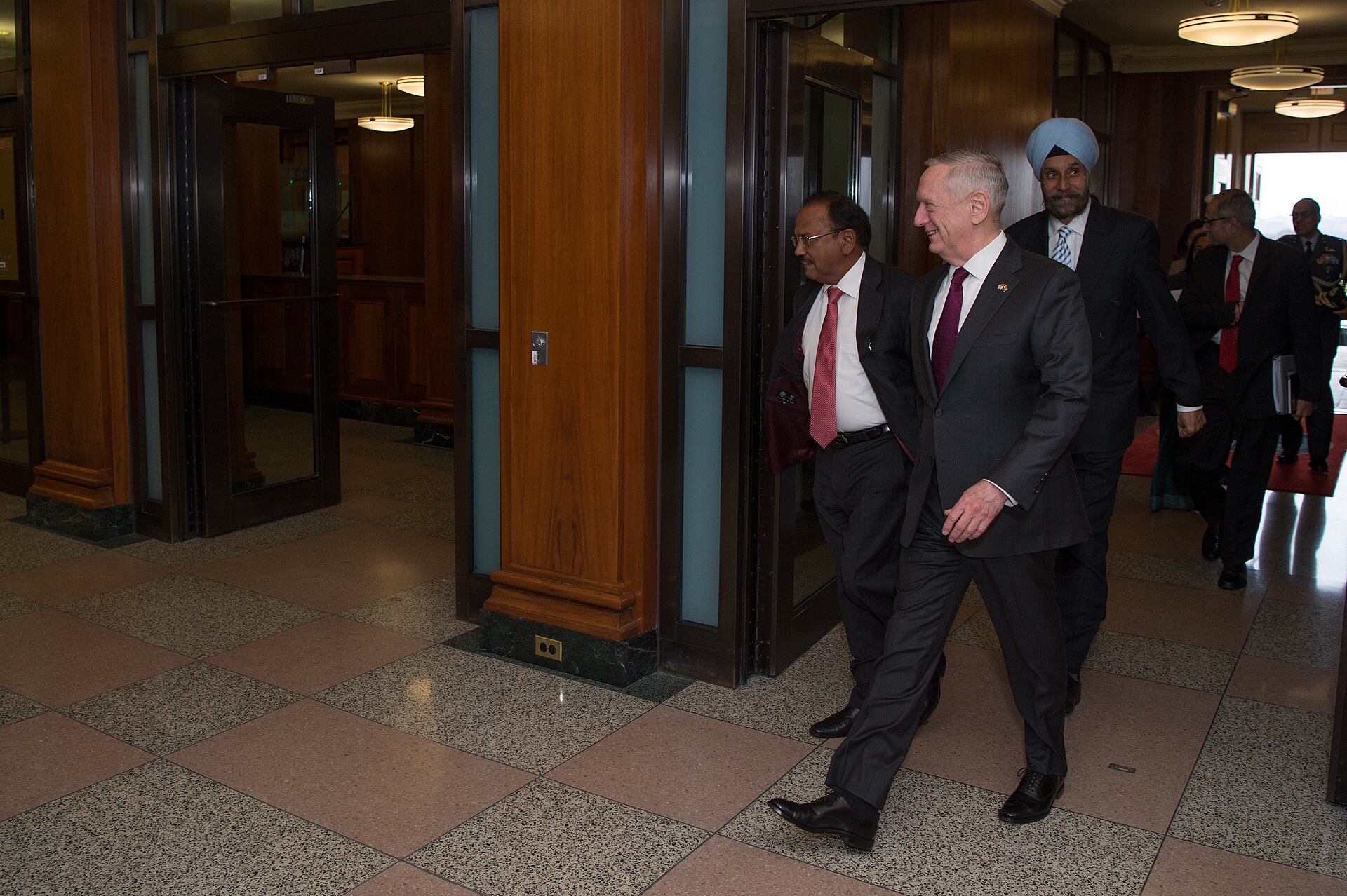 Indian NSA Ajit Doval walks with US Defense Secretary James Mattis at the Pentagon, March 2017 — the India-US security partnership that frames New Delhi's compliance bind on Iran sanctions