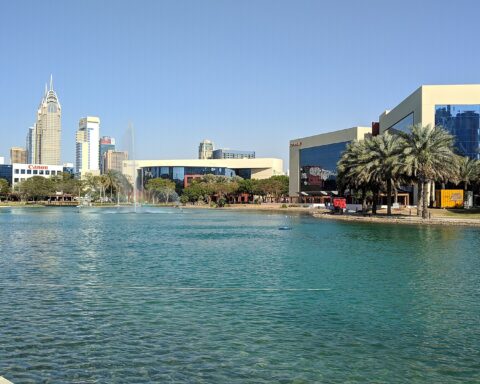 Dubai Internet City tech campus — Canon, IBM, and other multinational technology companies surround the central lake and amphitheater at Dubai Internet City, where Oracle maintains UAE cloud infrastructure targeted by IRGC claims