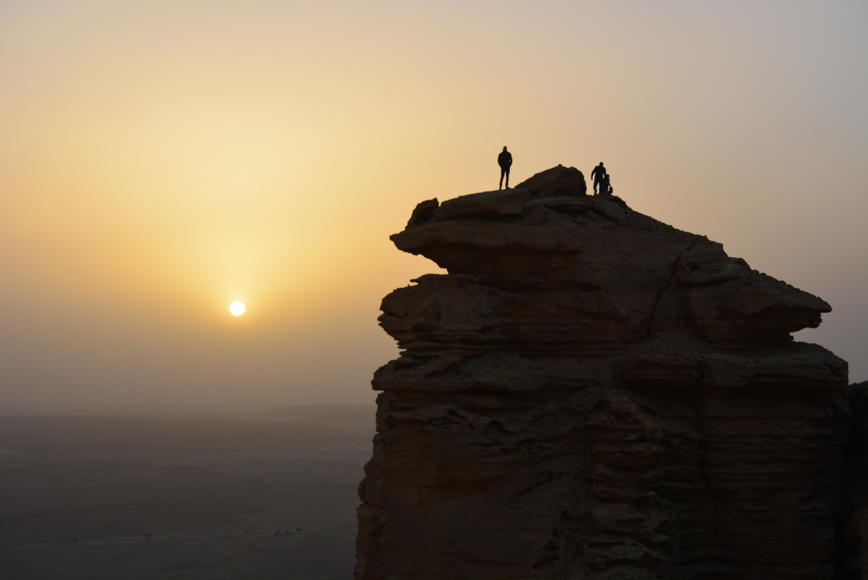 Dramatic cliff edge and vast desert plain seen from the Edge of the World viewpoint on the Tuwaiq Escarpment, Saudi Arabia