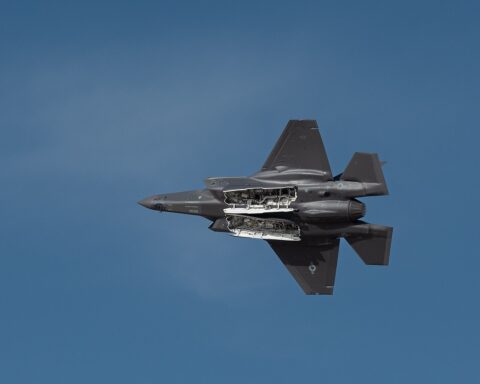 USAF F-35A Lightning II performs flying display at Dubai Airshow 2023, weapons bay open in flight over UAE