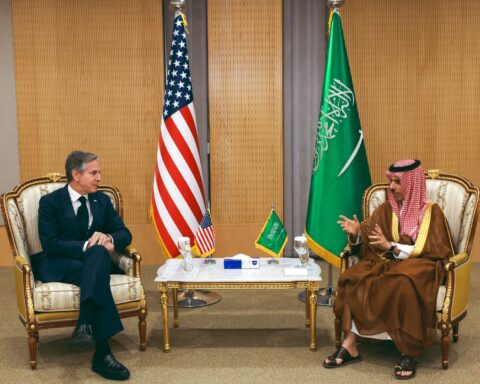 Saudi Foreign Minister Prince Faisal bin Farhan in bilateral diplomatic meeting with flags of United States and Saudi Arabia