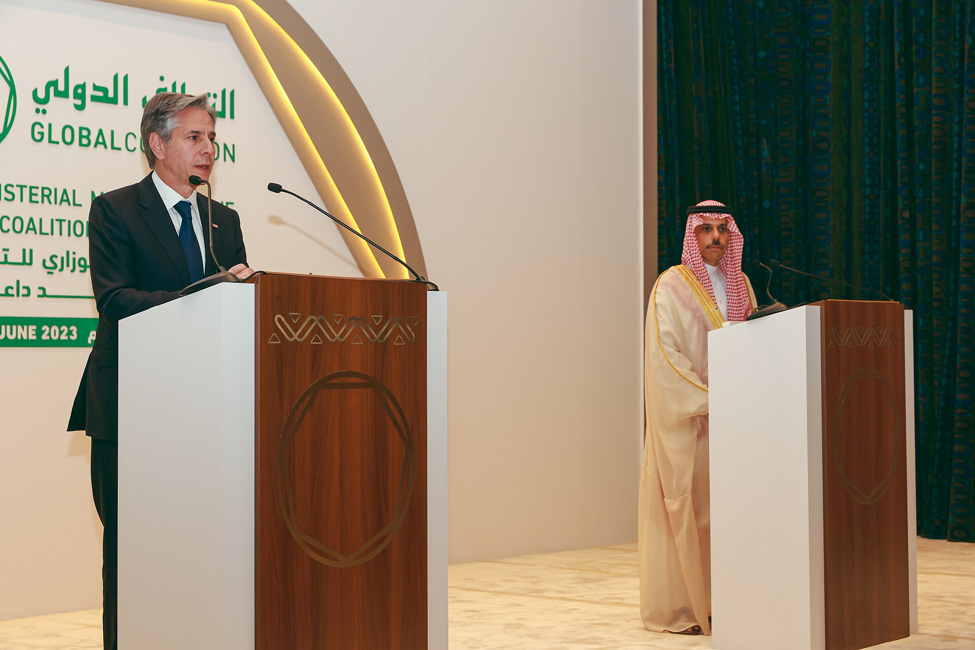 Saudi Foreign Minister Prince Faisal bin Farhan at press podium during Global Coalition ministerial conference in Riyadh, June 2023, the same diplomat who serves as Saudi co-guarantor in the Islamabad ceasefire framework
