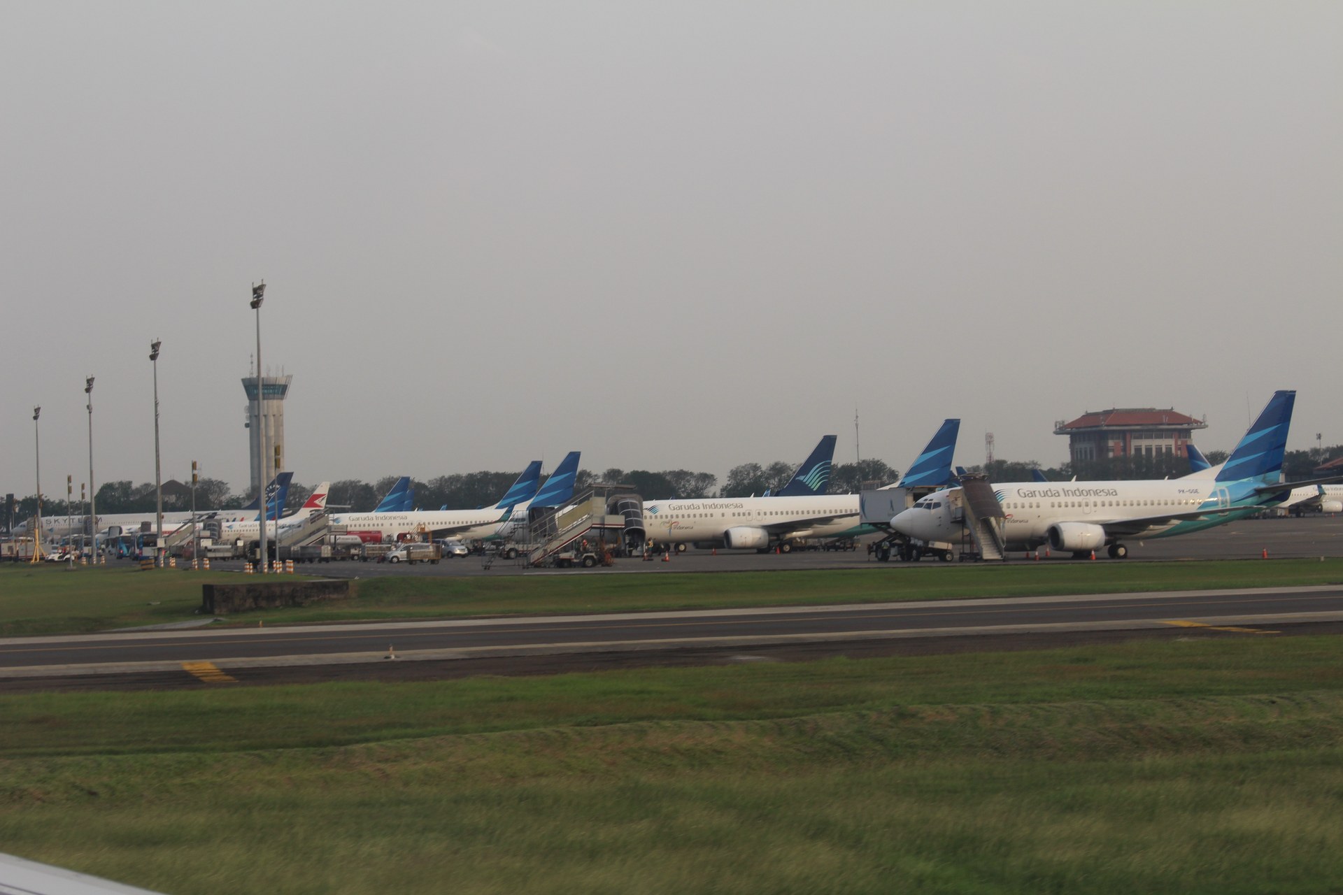 Garuda Indonesia aircraft lined up at Soekarno-Hatta International Airport Terminal 2F, the departure point for Indonesia's 221,000 Hajj pilgrims in 2026