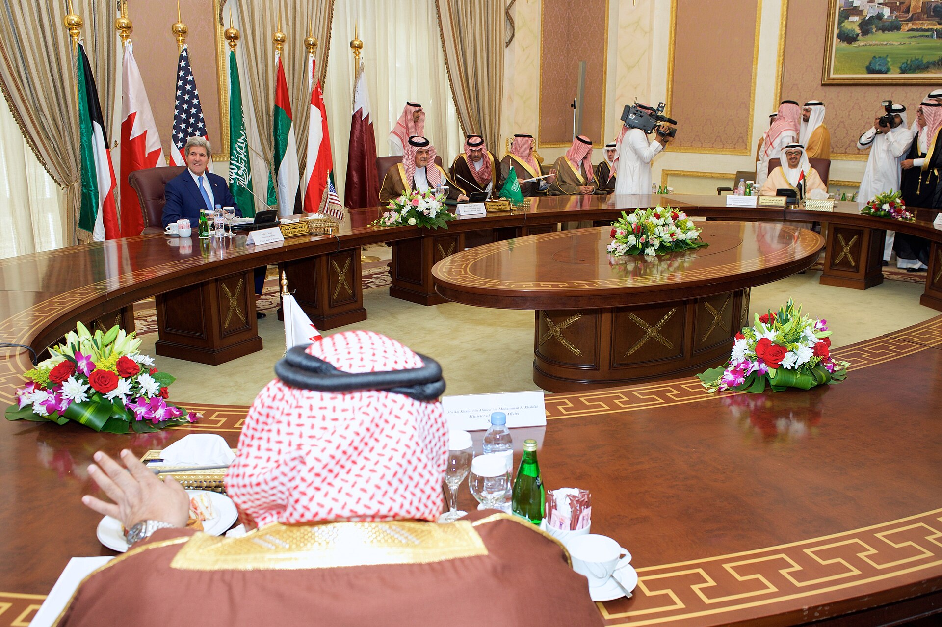 GCC foreign ministers and Secretary Kerry at round-table meeting in Saudi Arabia, 2015, with member state flags displayed