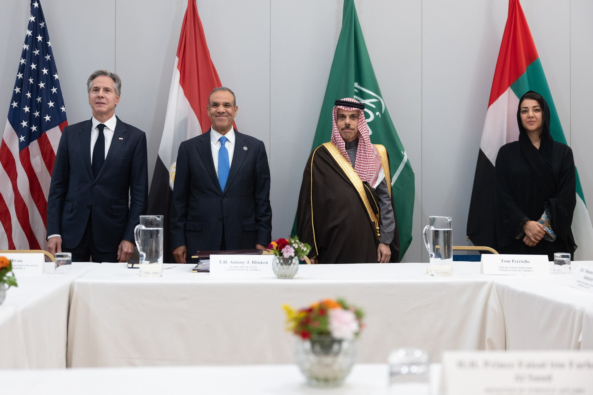 Saudi Foreign Minister Faisal bin Farhan Al-Saud and UAE Minister Reem al-Hashimy with Egypt FM and Secretary Blinken at G7 working session, Saudi Arabia and UAE flags visible