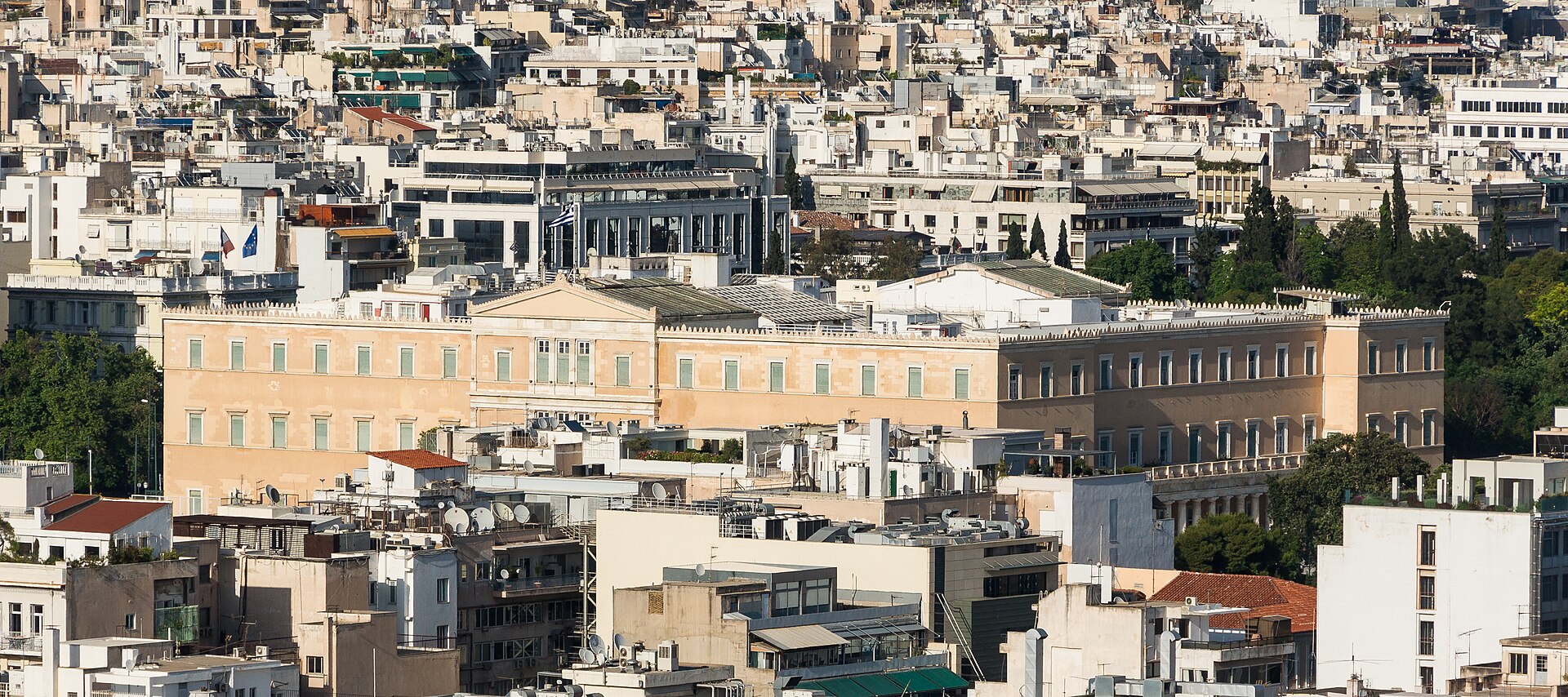 The Hellenic Parliament building in Athens, viewed from the Acropolis. The July 2024 parliamentary ratification of the ELDYSA SOFA passed with support from New Democracy, SYRIZA, and PASOK — but no party asked what the rules of engagement would be if Iran fired at Yanbu.