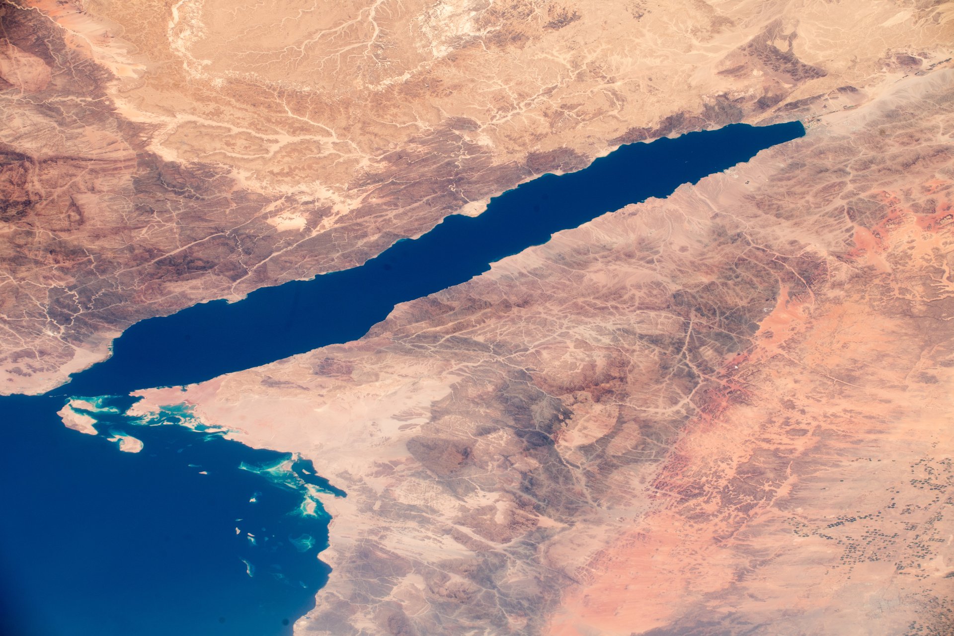 The Gulf of Aqaba from space, showing the tectonic rift separating Saudi Arabia from Egypt's Sinai Peninsula, with NEOM's coastline visible on the eastern shore